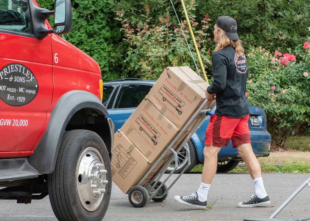 Portland mover pushing a hand truck