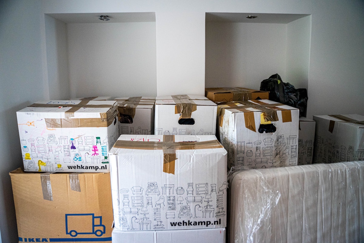 Boxes stacked in room before moving