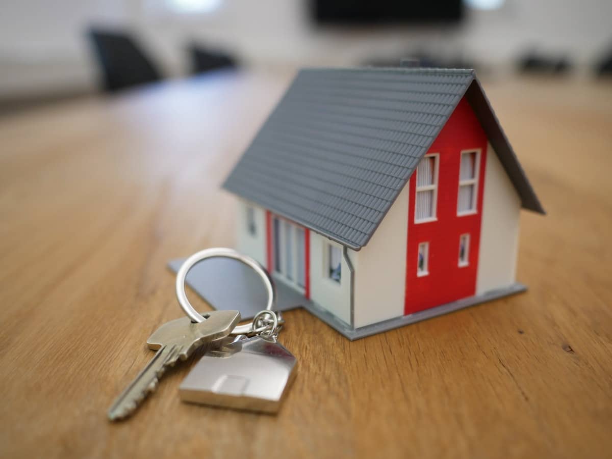 Mini house with house key attached to it