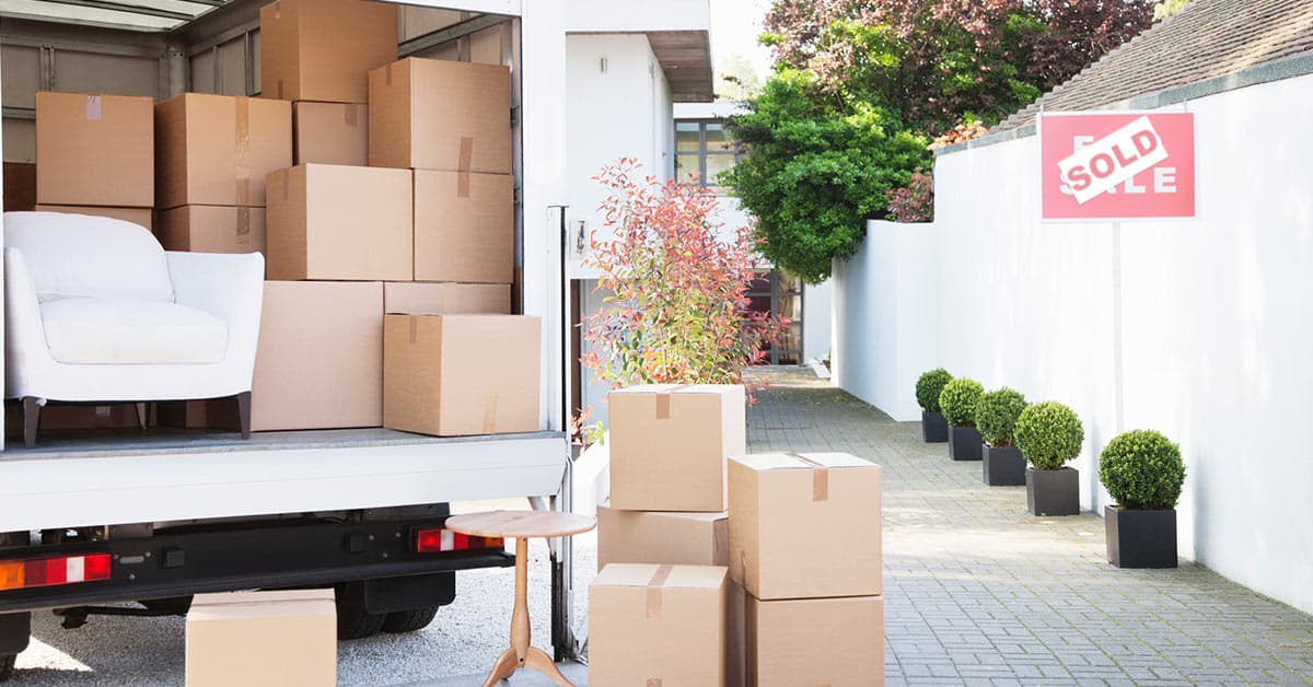 moving trucking being loaded in driveway